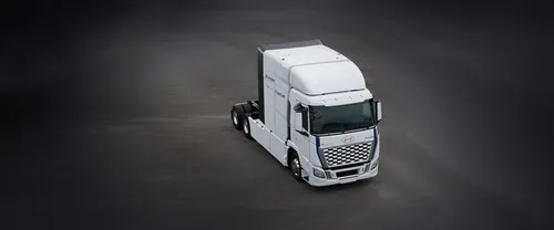 Hyundai XCIENT Fuel Cell truck parked on a dark asphalt surface, viewed from an elevated front angle, showcasing its aerodynamic design and zero-emission branding