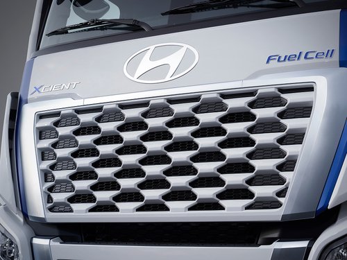 Front close-up of Hyundai XCIENT, showing flush-type front panel and badges