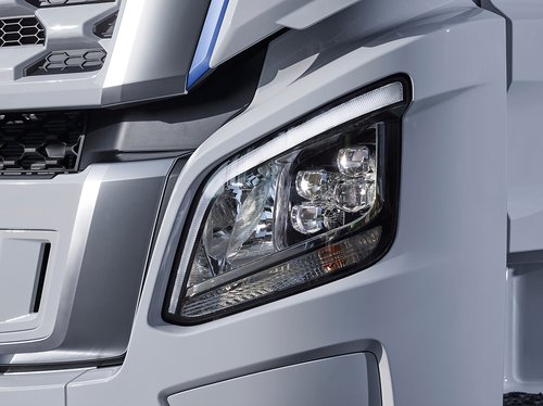 Close up of Hyundai XCIENT, showcasing LED headlamps with DRL